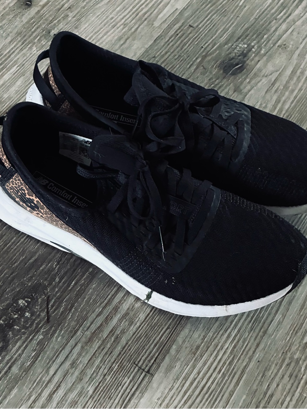 New Balance Women's Black Knit Sneaker with Leopard Heel Accent